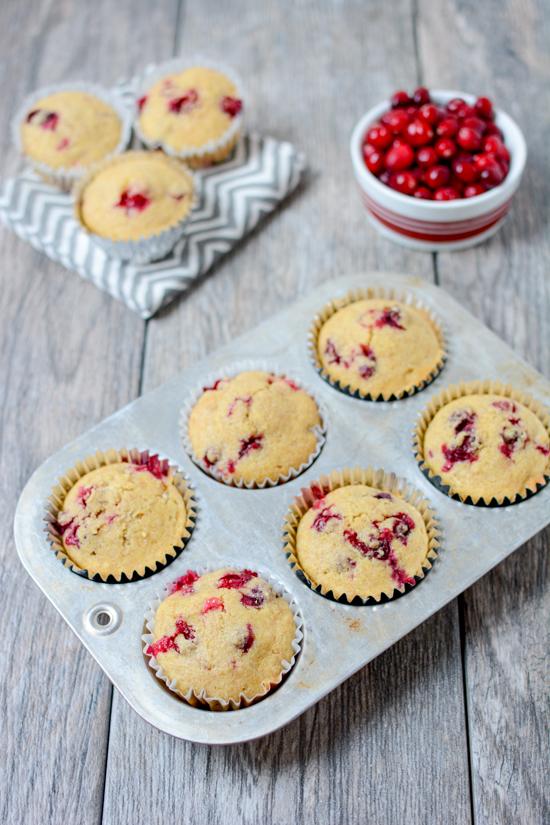 These Cranberry Corn Muffins are lightly sweetened and bursting with tart fresh cranberries. They make the perfect dinner side dish. Serve them with a hearty chili or make a batch for your holiday dinner.