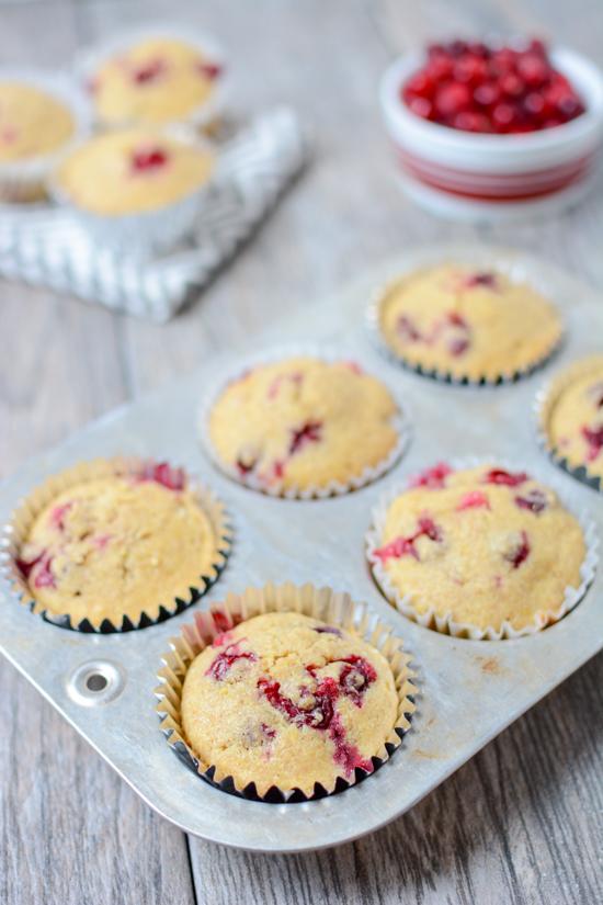 These Cranberry Corn Muffins are lightly sweetened and bursting with tart fresh cranberries. They make the perfect dinner side dish. Serve them with a hearty chili or make a batch for your holiday dinner.