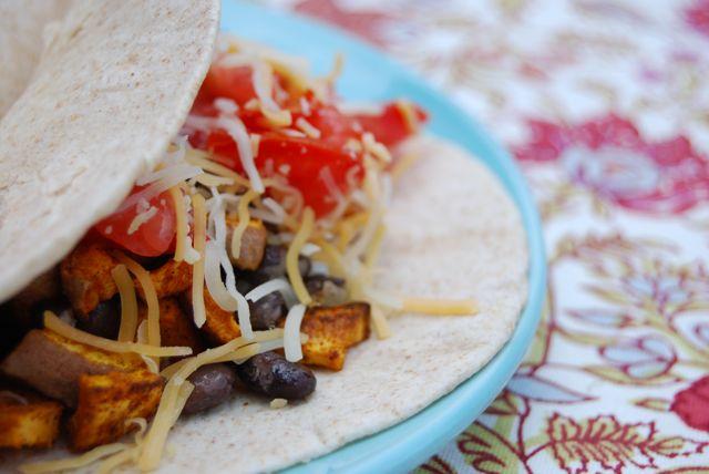 These Curried Sweet Potato & Black Bean Tacos make a hearty meatless meal any taco lover will adore!