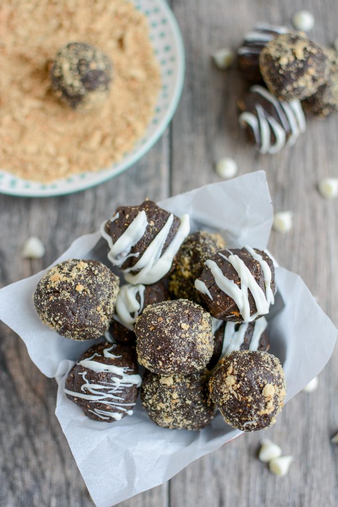 These Peanut Butter Chocolate Truffles are the perfect holiday dessert. Made with just four simple ingredients, they're easy to make and deliciously rich. Roll them in graham crackers or drizzle with chocolate to make them a little fancier!