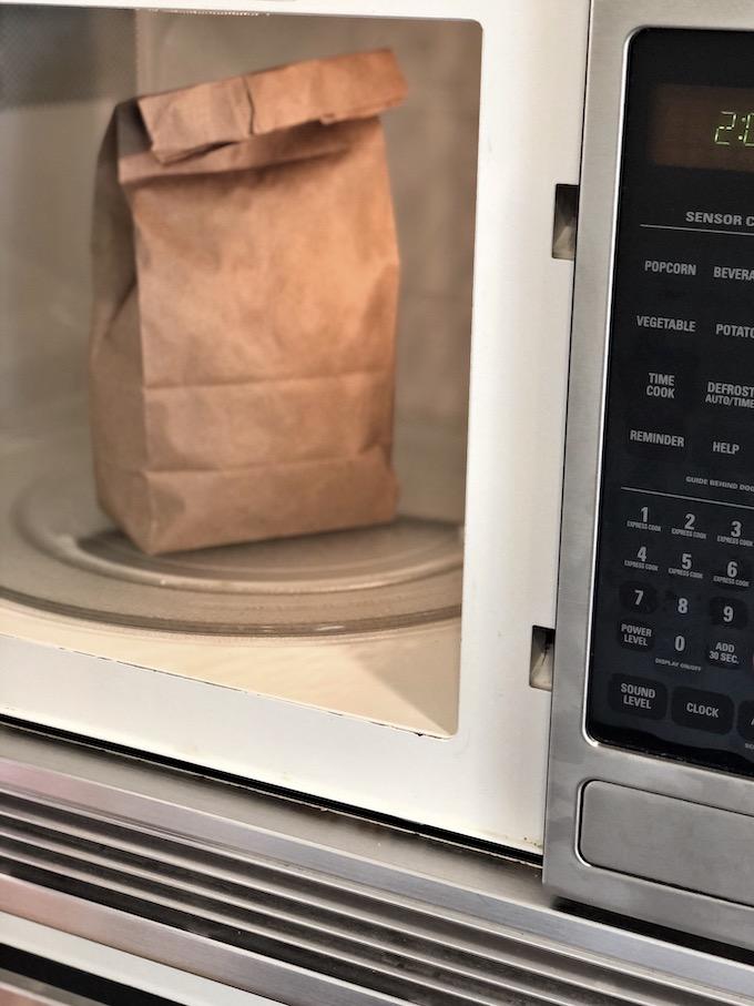 microwave popcorn in a brown paper lunch sack