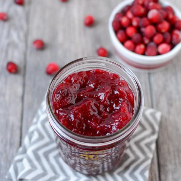 This Fresh Cranberry Sauce is simple to make, ready in 15 minutes and tastes great on everything from turkey to oatmeal! Make a batch and enjoy on your favorite breakfast, lunch, dinner and holiday recipes!