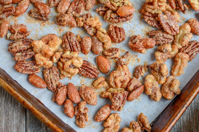 sweet and spicy mixed nuts on baking sheet - sweet and spicy pecans and almonds