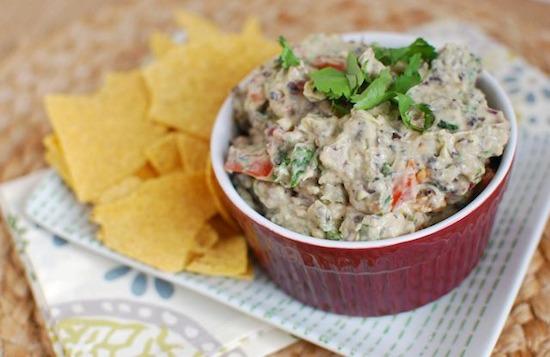 Add some extra protein and fiber to your guacamole thanks to the addition of Greek yogurt and black beans! Serve it as an appetizer and your guests won't know the difference! 