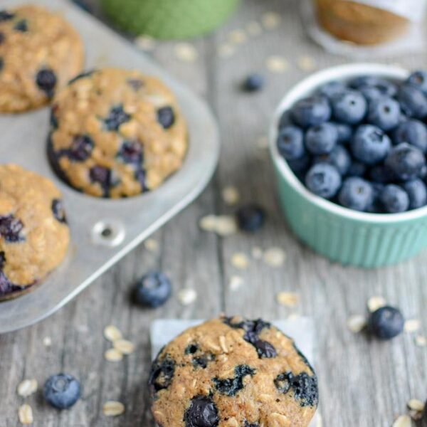 Blueberry Muffins with a bowl of blueberries and oats