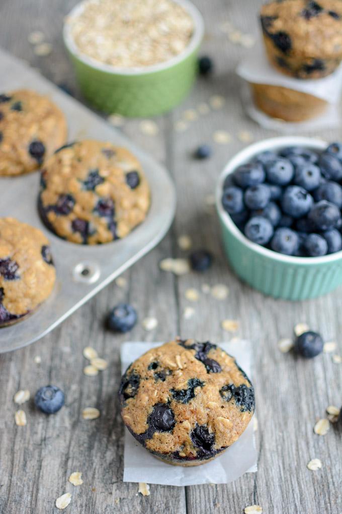 Blueberry Muffins with a bowl of blueberries and oats