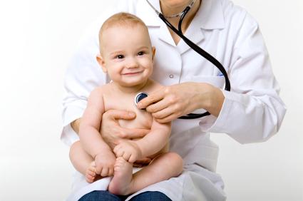 young doctor with happy baby making examination