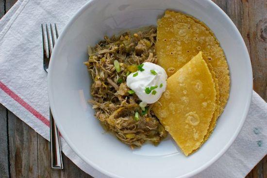 This Slow Cooker Salsa Verde Chicken requires just four ingredients. Throw everything in the crockpot before work and dinner will be waiting when you come home!