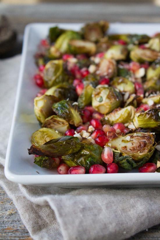 Brussels Sprouts with Pomegranate Seeds make beautiful holiday side dish. Bright red pomegranate seeds make these delicious, crispy caramelized Brussels sprouts pop with festive flair. 