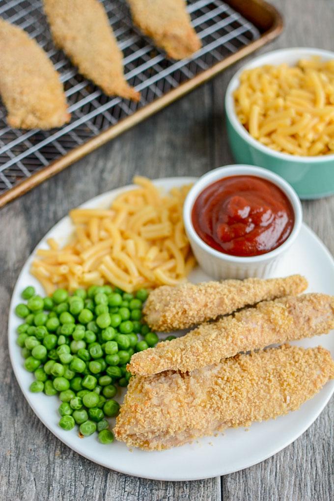 Freezer Chicken Tenders with steamed peas and mac and cheese for dinner