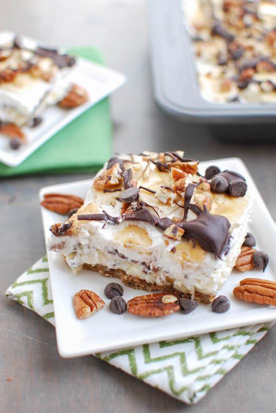 A fun twist on traditional, these Banana Cream Pie Bars are made with homemade vanilla pudding and whipped cream, plus fresh bananas and lots of pecans, peanut butter and chocolate for a delicious dessert. 