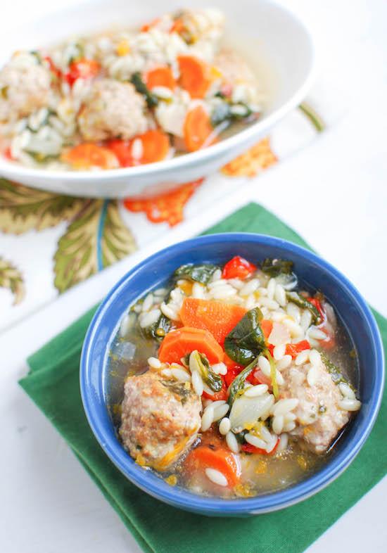 Packed with vegetables and mini meatballs, this Italian Wedding Soup is hearty, filling and sure to warm you up on even the coldest day!