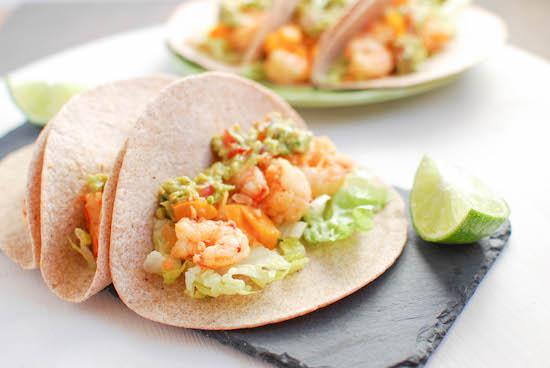 Slightly sweet and full of spice, these Spicy Shrimp Tacos are ready in 15 minutes, making them the perfect weeknight dinner!