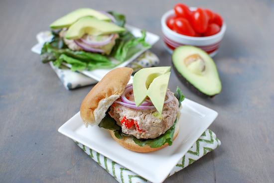 These California Turkey Burgers are packed with delicious flavors thanks to avocado, roasted red peppers and bacon. Perfect for grilling season!