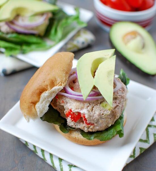 These California Turkey Burgers are packed with delicious flavors thanks to avocado, roasted red peppers and bacon. Perfect for grilling season!