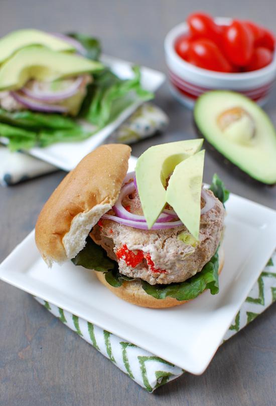 These California Turkey Burgers are packed with delicious flavors thanks to avocado, roasted red peppers and bacon. Perfect for grilling season!