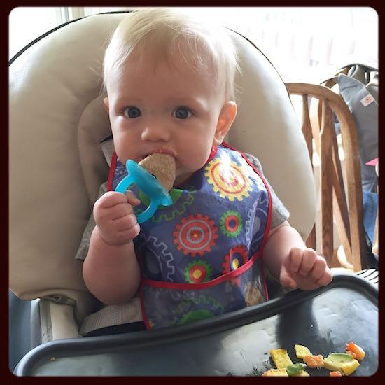 baby eating popsicle