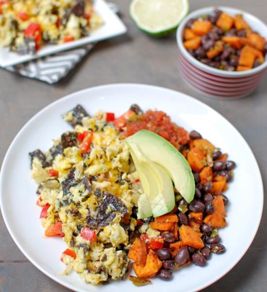 Tex-Mex Migas are a simple, vegetarian recipe that's perfect for lunch or dinner. Pairing it with a simple sweet potato and black bean hash adds some extra protein and fiber!