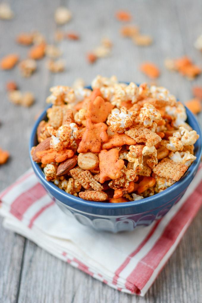 The perfect balance of spicy and sweet, this Popcorn Snack Mix is healthier than traditional Chex mix and highly addictive. Make a batch for your game day party or an afternoon snack.