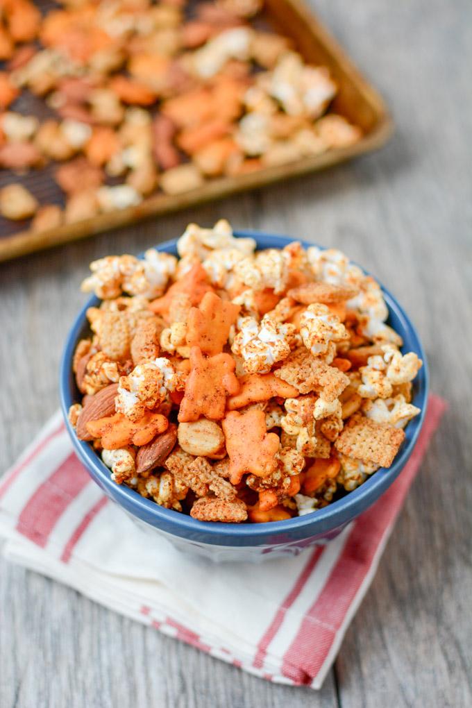 The perfect balance of spicy and sweet, this Popcorn Snack Mix is healthier than traditional Chex mix and highly addictive. Make a batch for your game day party or an afternoon snack.