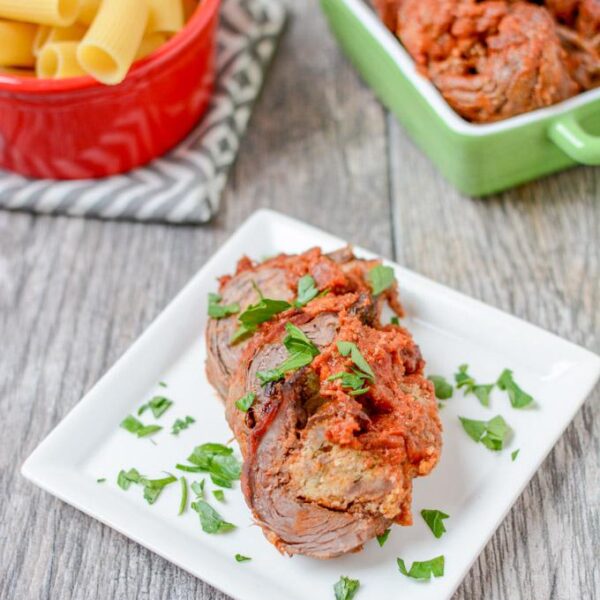 This recipe for Braciole is thinly sliced flank steak stuffed with sausage and simmered in tomato sauce until tender. Eat it solo or pair with pasta for a more traditional Italian dinner.