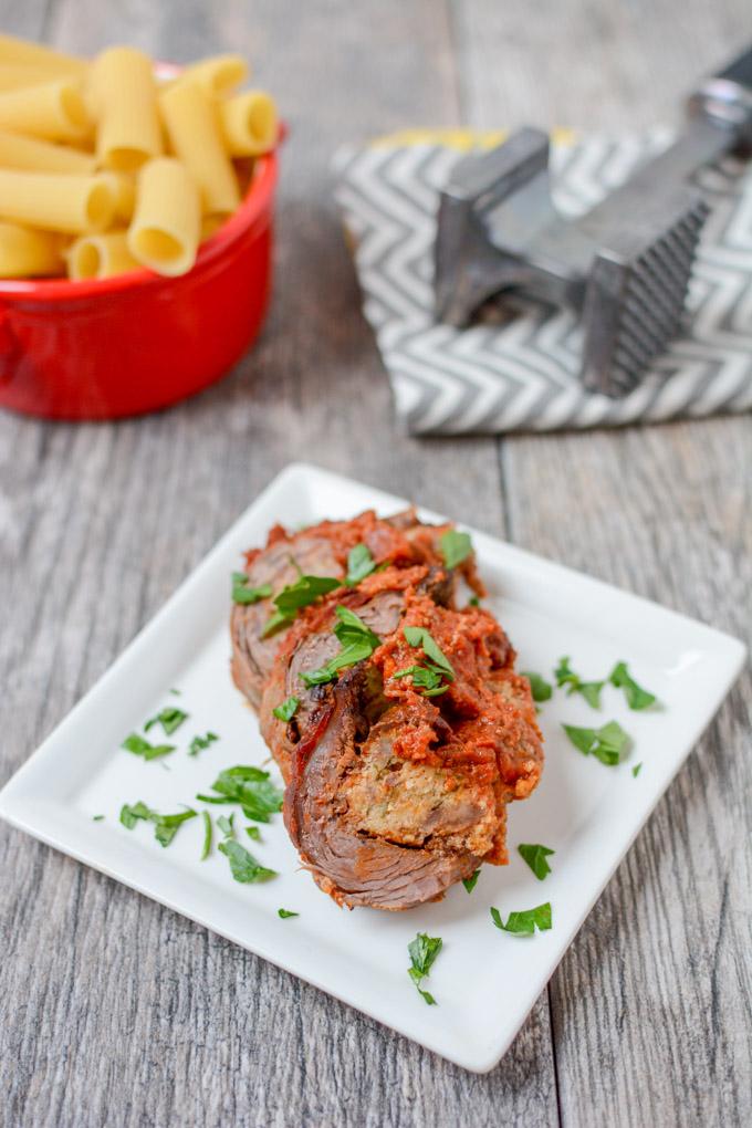 This recipe for Braciole is thinly sliced flank steak stuffed with sausage and simmered in tomato sauce until tender. Eat it solo or pair with pasta for a more traditional Italian dinner.