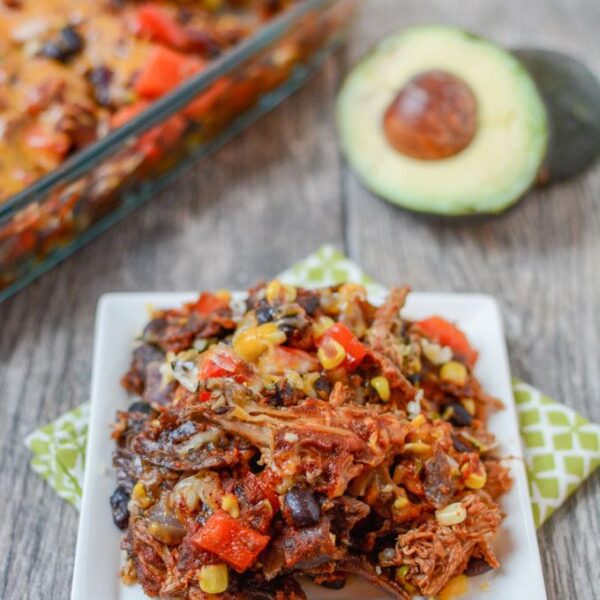 This recipe for Salsa Verde Pork Enchilada Casserole easily makes two dinners. Serve the slow cooker salsa verde pork with rice one night and turn the leftovers into enchilada casserole later in the week.