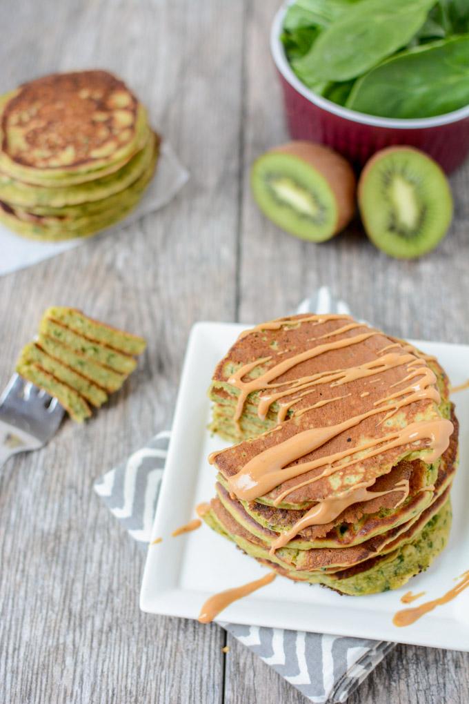 This recipe for Green Smoothie Pancakes has all the healthy ingredients from your favorite smoothie in pancake form so you can prep them ahead of time and reheating for breakfast during the week!