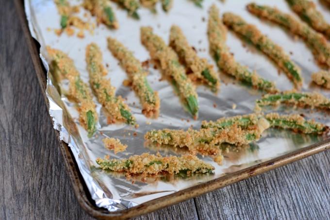 Crispy green bean fries on a sheet pan