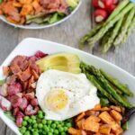 Loaded with spring vegetables and topped with over-easy eggs, this paleo, gluten-free Spring Breakfast Salad is an easy and delicious way to start your day with more veggies!