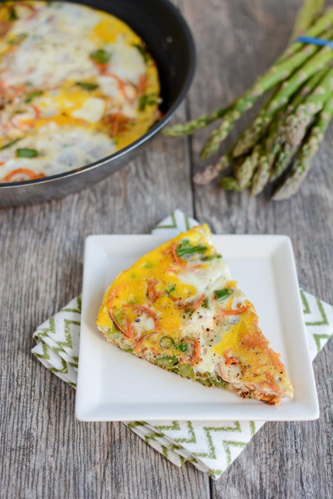 This recipe for a Spring Vegetable Frittata is packed with seasonal veggies like asparagus and peas and is perfect for breakfast, lunch or dinner!