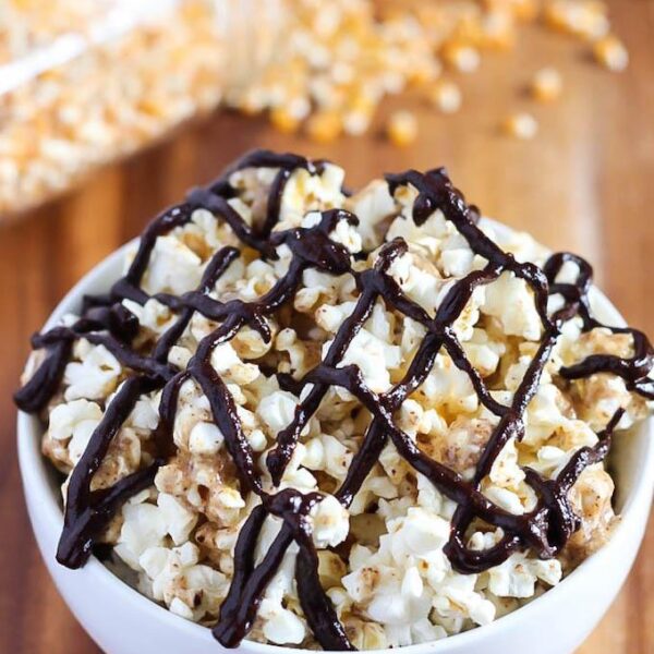 This recipe for vegan, gluten-free Chocolate Almond Butter Popcorn is simple to make, healthy enough for a snack and makes a perfect movie night dessert!