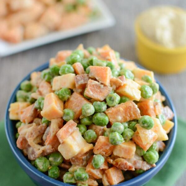 This Pea Salad with Sweet Potatoes is a healthy, kid-friendly recipe the whole family will love for dinner. Covered in hummus and mixed with bacon and cheese, what's not to love about this side dish?