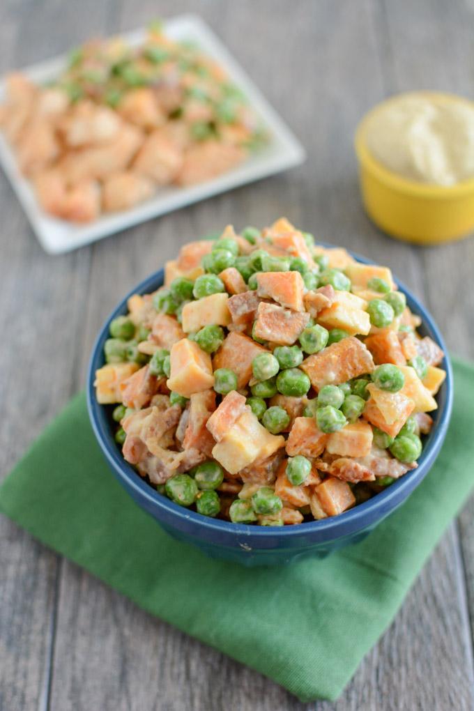 This Pea Salad with Sweet Potatoes is a healthy, kid-friendly recipe the whole family will love for dinner. Covered in hummus and mixed with bacon and cheese, what's not to love about this side dish?