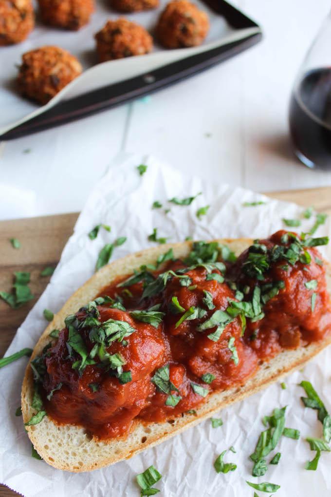 This Mushroom Quinoa Meatball Sandwich recipe is a great meatless alternative to your favorite meatball sub! Enjoy it with a glass of wine for an easy vegetarian dinner!