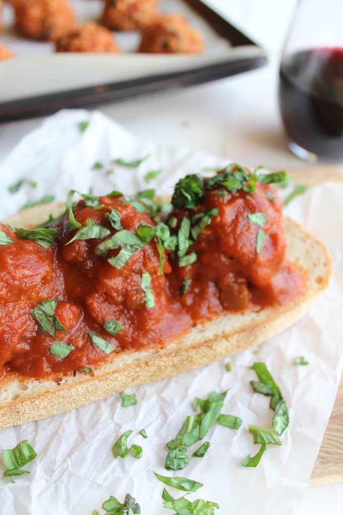 This Mushroom Quinoa Meatball Sandwich recipe is a great meatless alternative to your favorite meatball sub! Enjoy it with a glass of wine for an easy vegetarian dinner!