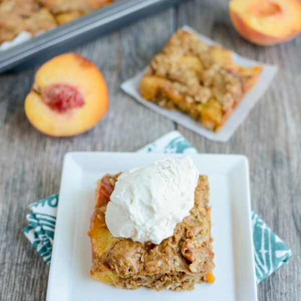 This recipe for Ginger Peach Oat Bars is perfect for a summer dessert. They're packed with fresh, juicy peaches and taste great topped with a scoop of vanilla ice cream!