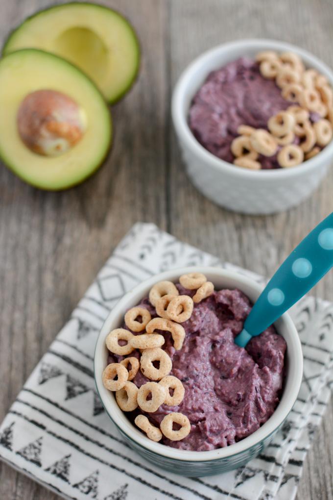 This Blueberry Avocado Smoothie Bowl is packed with nutritious and healthy first foods to give your baby! Plus it's super thick to help them practice their self-feeding skills.