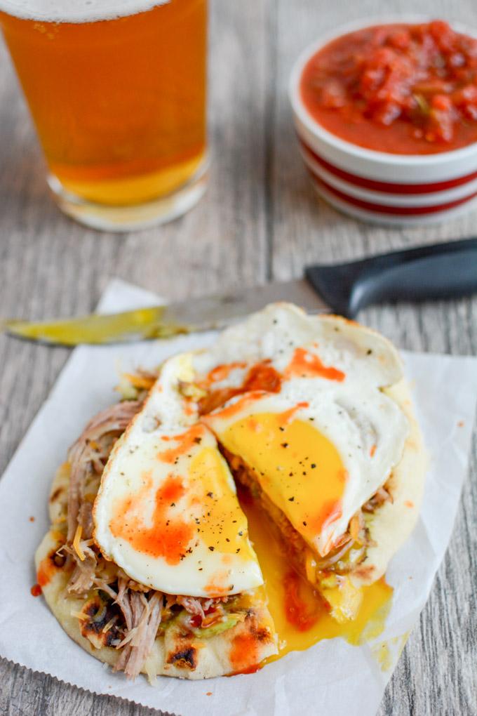 Pork and Egg Breakfast Pizza 5 This Pork and Egg Breakfast Pizza is perfect for a late morning football party or tailgating. Cook the pork overnight, then just shred, assemble and top with an egg!