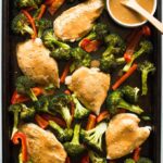 This easy Sheet Pan Chicken and Vegetables is a quick, healthy dinner recipe. Top it with a flavorful peanut sauce and the whole family will love it!