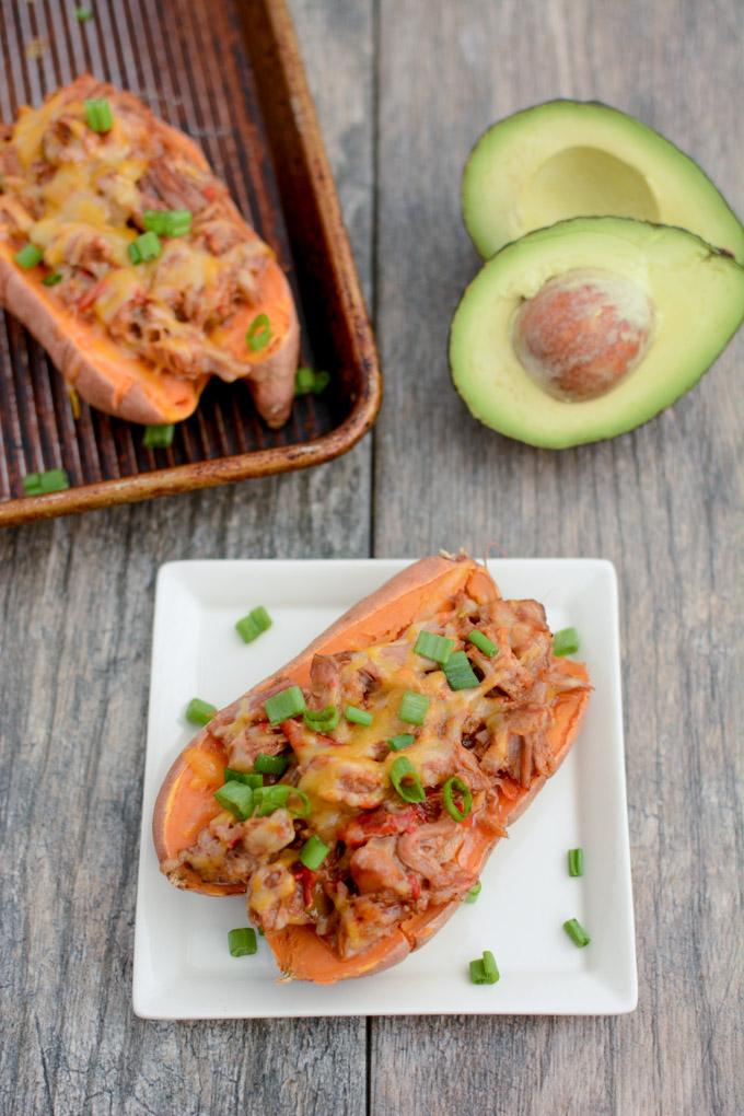 These BBQ Pulled Pork Stuffed Sweet Potatoes are perfect for food prep. Make a big batch of pulled pork and sweet potatoes, stuff them ahead of time and reheat to eat for lunch or dinner.