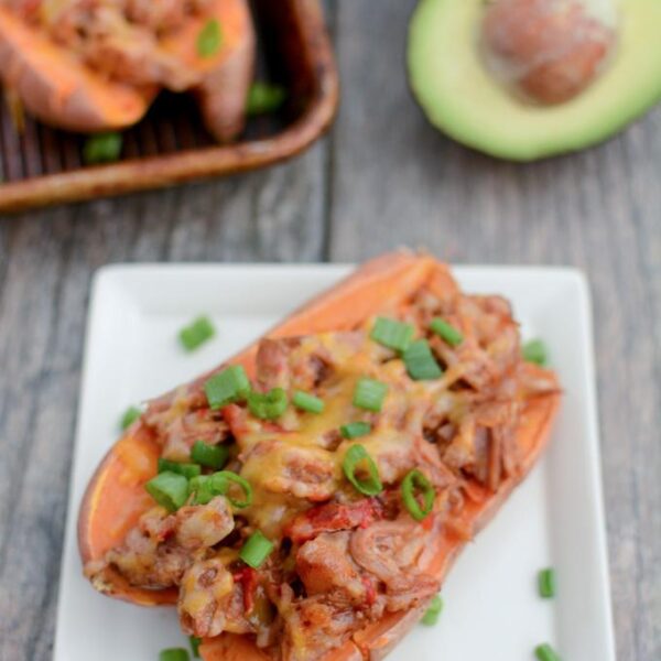 These BBQ Pulled Pork Stuffed Sweet Potatoes are perfect for food prep. Make a big batch of pulled pork and sweet potatoes, stuff them ahead of time and reheat to eat for lunch or dinner.