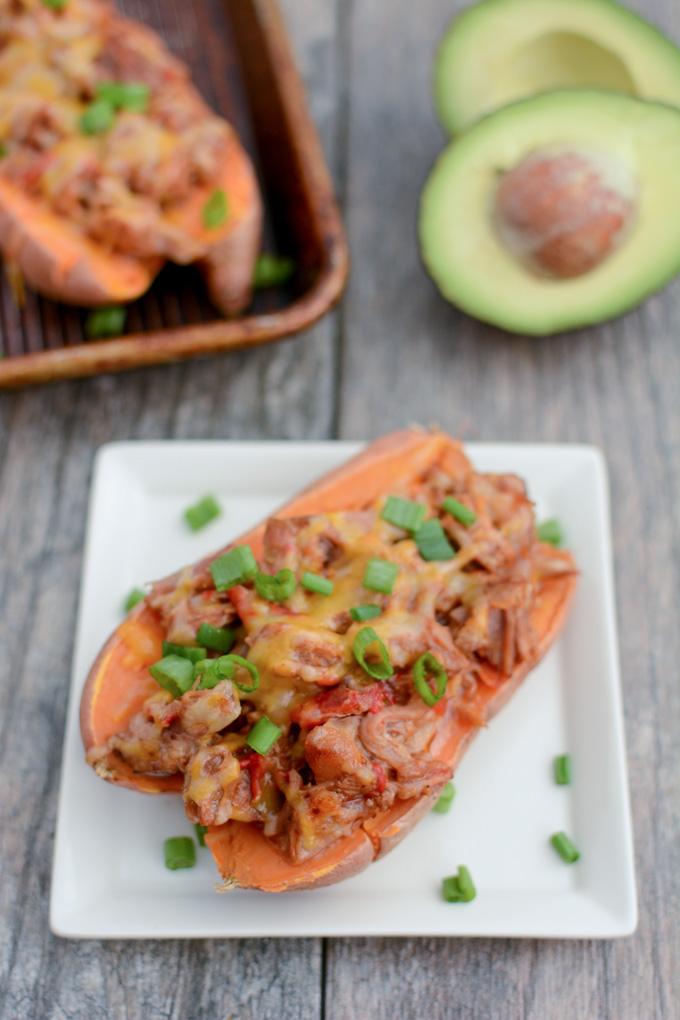 These BBQ Pulled Pork Stuffed Sweet Potatoes are perfect for food prep. Make a big batch of pulled pork and sweet potatoes, stuff them ahead of time and reheat to eat for lunch or dinner.