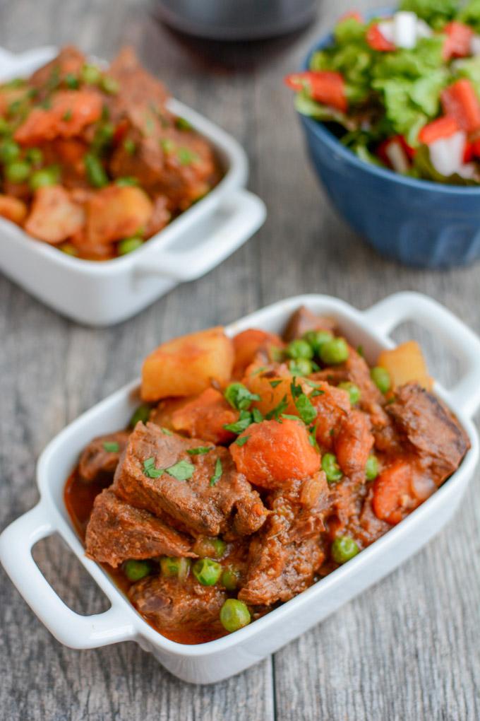 This healthy Instant Pot Beef Stew recipe is ready in under an hour and tastes like it has been simmering all day. It's paleo, gluten-free and the perfect dinner on a cold winter night.