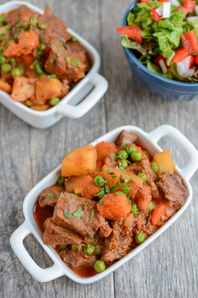 This healthy Instant Pot Beef Stew recipe is ready in under an hour and tastes like it has been simmering all day. It's paleo, gluten-free and the perfect dinner on a cold winter night.