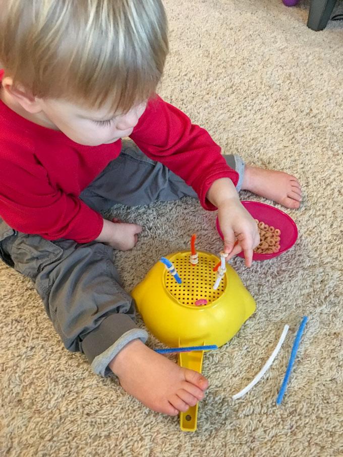 Indoor Activities For Toddlers 11 cheerio threading
