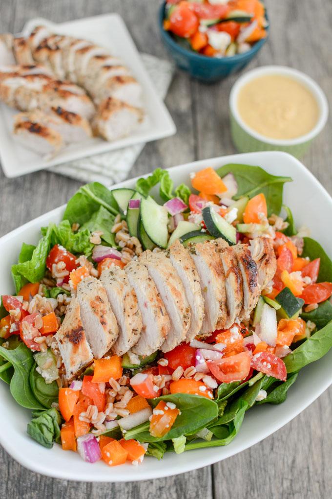 This Mediterranean Turkey Spinach Salad recipe is packed with protein and flavor! Prep the components ahead of time and assemble for a quick, healthy lunch or dinner!