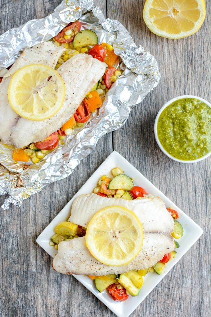 This recipe for Grilled Foil Packet Tilapia with Pesto Veggies is perfect for a summer dinner! It's quick, easy and healthy, plus cleanup is a breeze!