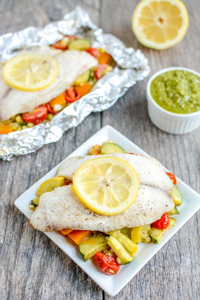 This recipe for Grilled Foil Packet Tilapia with Pesto Veggies is perfect for a summer dinner! It's quick, easy and healthy, plus cleanup is a breeze!