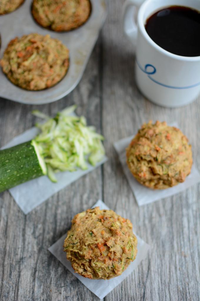 Zucchini Carrot Apple Muffins with a mug of coffee